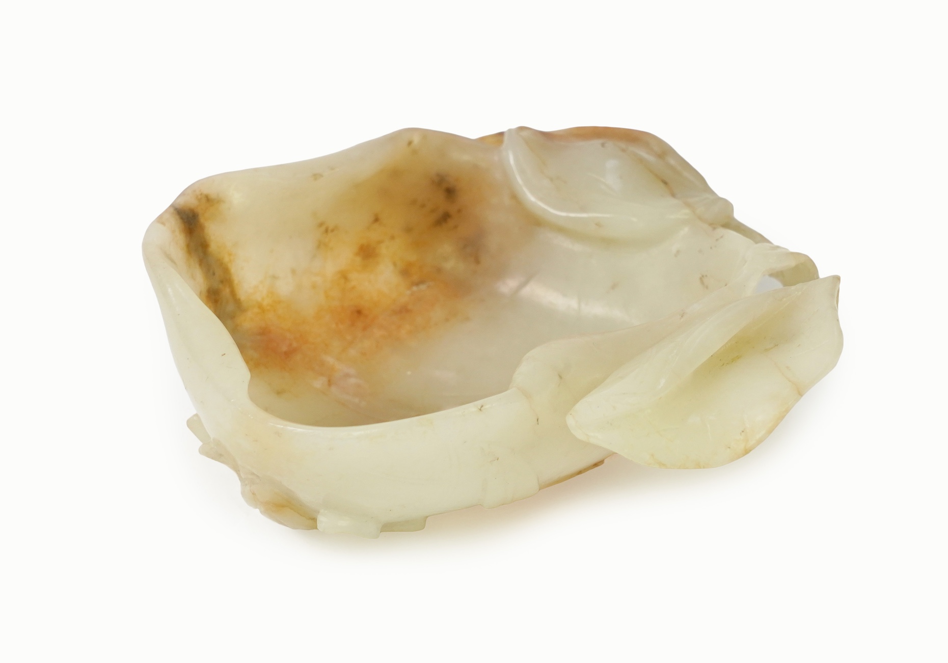 A Chinese pale celadon and russet jade brushwasher, Ming dynasty, 16th/17th century